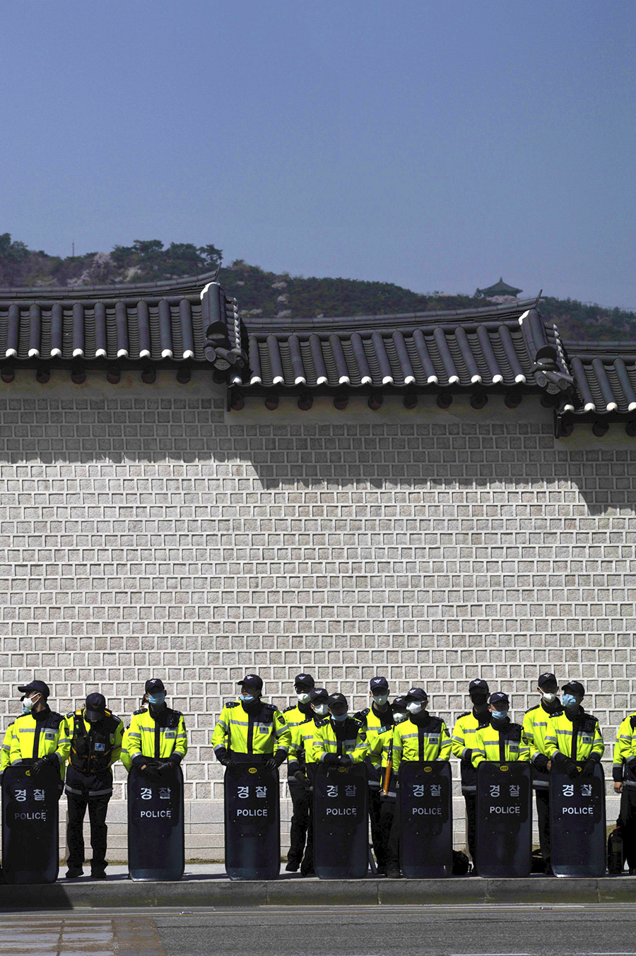 A Police Unit in front of the Old Wall